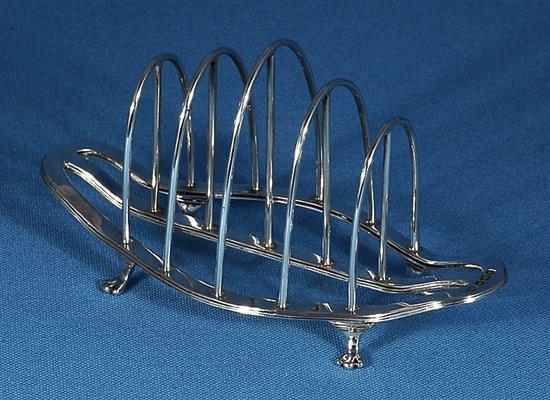 A matched pair of George V silver toast racks, by George Howson, Length 153mm weight 7.7oz/241grms